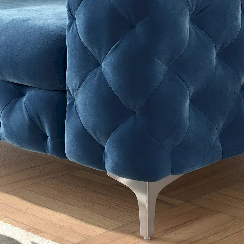 Fauteuil club en velours capitonné