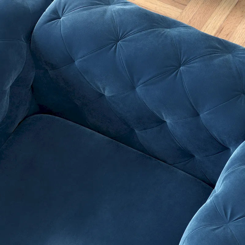 Fauteuil club en velours capitonné