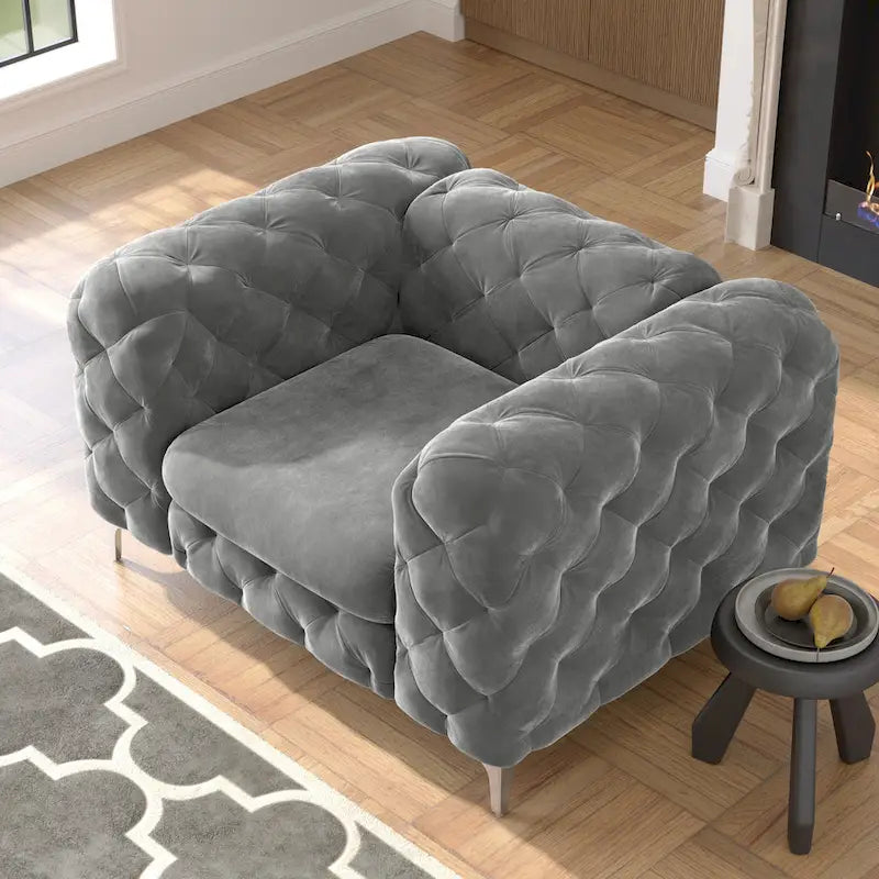Fauteuil club en velours capitonné
