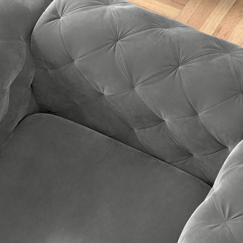 Fauteuil club en velours capitonné